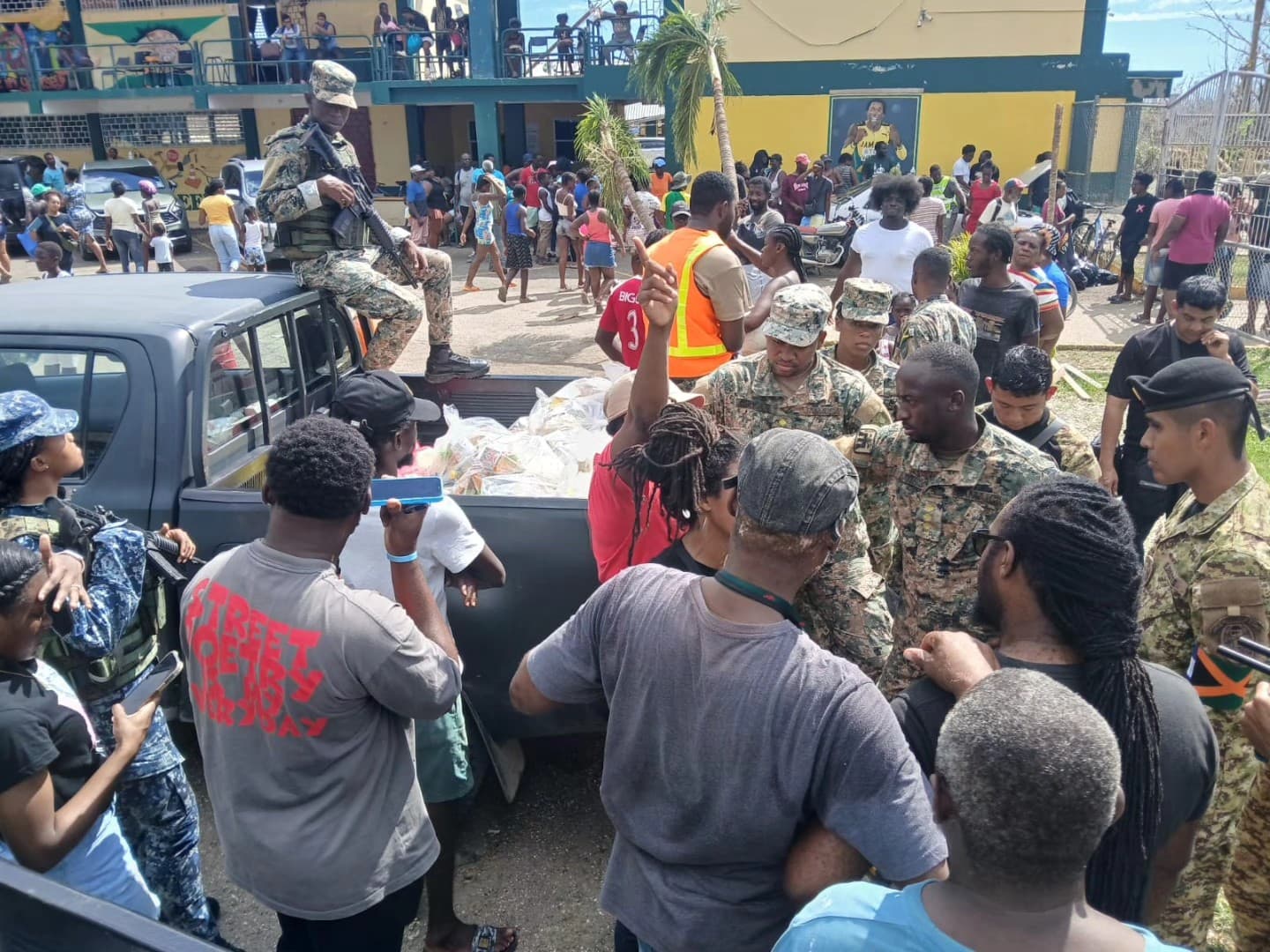 Residents at the Petersfield High School shelter scramble to relocate amidst the reopening of schools